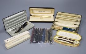 A collection of fountain pens, ballpoint pens and pencils, comprising a Conway Stewart Dinkie