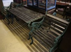 Four cast metal slatted wood garden armchairs and matching rectangular table, table width 126cm