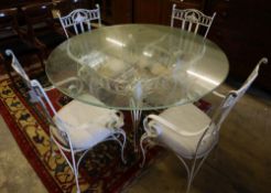 A French cast and wrought iron circular glass top garden table and four chairs, table diameter