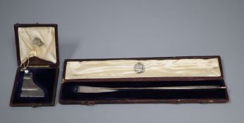 A cased Victorian part textured silver miniature presentation oar, 17.7cm and similar rudder, by