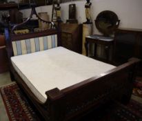 A William IV mahogany Gothic design bedstead, width 140cm