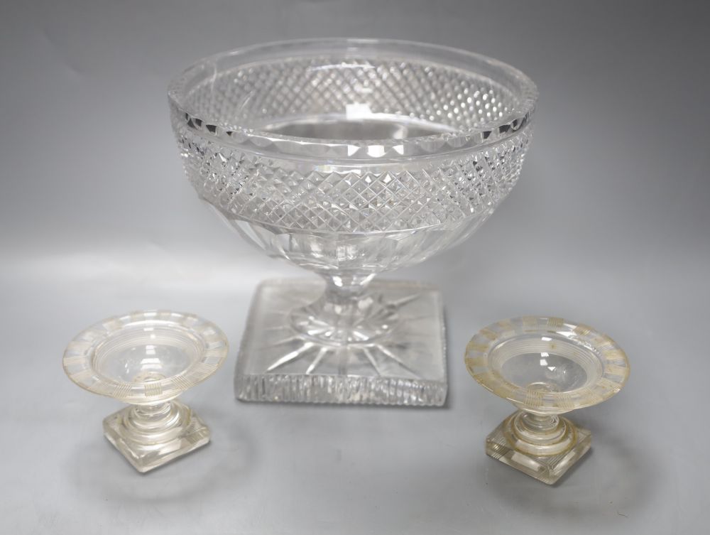 A deeply cut glass pedestal bowl, diameter 20cm and a pair of miniature glass comports, diameter