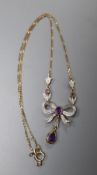 An amethyst-set 'tied ribbon' pendant with drop on 9ct gold fine chain, 40cm, gross 4.1 grams.