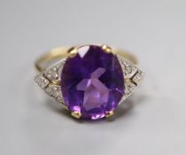 An Art Deco style yellow metal, amethyst and diamond seven-stone ring, the oval amethyst claw-set,