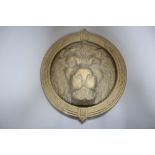 A large cast brass lion's head door knocker, diameter 21cm