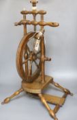 An oak and beech spinning wheel, height 63cm