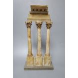 After the Antique. A Grand Tour carved and stained alabaster model of Ruins, height 34cm