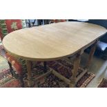 An 18th century style oak gateleg dining table, 175cm extended