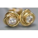 A pair of modern 750 yellow metal and solitaire diamond set 'knot' ear studs, 8mm, gross 3.8 grams.