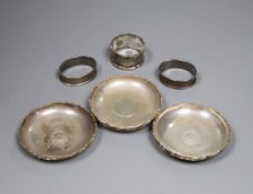 Six Hong Kong sterling dishes, with inset coin and three napkin rings.