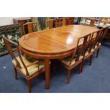 A Chinese hardwood dining table, 234cm extended (three spare leaves), width 112cm, height 76cm and