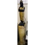 A pair of carved and giltwood 'Egyptian' figure table lamps, on reconstituted marble columns,