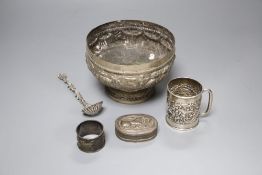 An Edwardian silver christening mug, a Victorian silver foliate sifter spoon, an Indian? bowl,