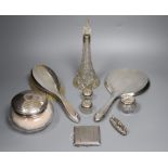 A silver-mounted conical glass scent bottle, sundry other silver-mounted toilet items and an