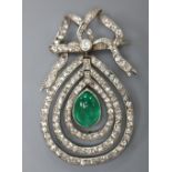 An Edwardian articulated white metal, cabochon emerald and diamond set teardrop shaped drop