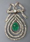 An Edwardian articulated white metal, cabochon emerald and diamond set teardrop shaped drop