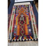 A Kelim polychrome wool rug, 138 x 82cm