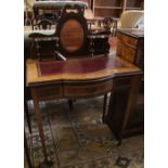 A late Victorian satinwood banded mahogany bowfront writing table, width 76cm, depth 45cm, height