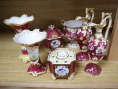 A group of English porcelain ruby ground vessels, c. 1825-45, including two inkwells and one