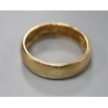 A 9ct yellow gold wedding ring, size Q, 6.7 grams.