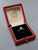 A modern Cartier platinum and Princess cut solitaire diamond ring, size M, gross 4.8 grams, the