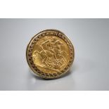 A George V 1912 gold sovereign, now in 9ct gold ring mount, size Q, gross 14.1 grams.