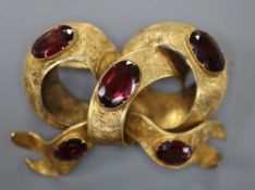 A Victorian yellow metal and five stone oval garnet set scroll mourning brooch, 49mm, gross 11.8