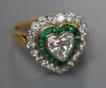 A modern 18ct gold, heart shaped diamond and emerald cluster set heart shaped dress ring, size N,