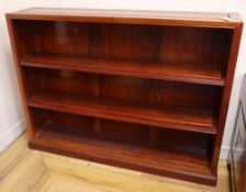A Chinese hardwood open bookcase, width 122cm, depth 25cm, height 91cm