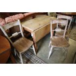 A Victorian pine Pembroke table, width 98cm and three Victorian Windsor chairs