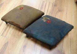 A pair of ebonised and upholstered footstools, lozenge shape, 40cm approx.