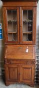 An Edwardian Arts & Crafts oak bureau bookcase, width 70cm, depth 34cm, height 196cm