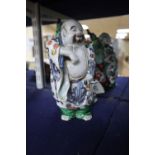 A Japanese Kutani figure of Hotei, 21cmCONDITION: His left foot - first three toes glue
