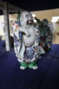 A Japanese Kutani figure of Hotei, 21cmCONDITION: His left foot - first three toes glue