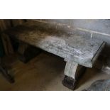 A reconstituted stone garden bench seat, width 106cm