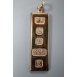 A 9ct gold ingot pendant, 47mm, 14.3 grams.