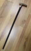 A silver mounted ebony walking cane with rhinoceros horn handle, 79cm