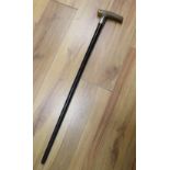 A silver mounted ebony walking cane with rhinoceros horn handle, 79cm