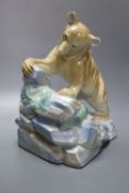 A Wade porcelain brown bear, dated 1939, height 25cmCONDITION: Right ear with two shallow chips,