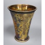 A George V silver gilt beaker, of flared form, Vander & Hedges, London 1912, 11.3cm, 6oz.