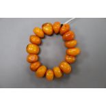 An amber pebble shaped bead bracelet, gross 59 grams.