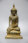 An 18th century Burmese Buddha, with traces of original gilding on bronze, height 27cm