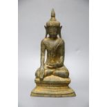 An 18th century Burmese Buddha, with traces of original gilding on bronze, height 27cm