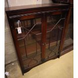 A reproduction mahogany bookcase, with astragal glazed doors, width 81cm, depth 25cm, height 102cm