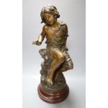 After August Moreau. A patinated spelter model of a seated youth, "Enfant au Crabe", on marbled wood