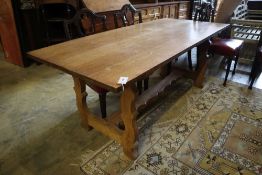 A Spanish style oak refectory dining table, width 183cm depth 80cm height 72cm