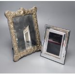 A modern repousse silver mounted easel mirror, 29.6cm and a base metal mounted photograph frame.