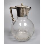 A late Victorian silver-mounted glass globular claret jug in the style of Christopher Dresser, James