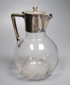 A late Victorian silver-mounted glass globular claret jug in the style of Christopher Dresser, James