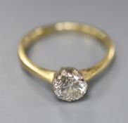 A modern 18ct gold and solitaire diamond ring, size M, gross 2.9 grams, the stone weighing